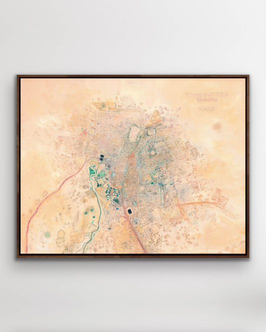 Framed stretched canvas art print of original oil painting—colorful abstract aerial view of Timbuktu, Mali in warm pink, coral, and desert tones.