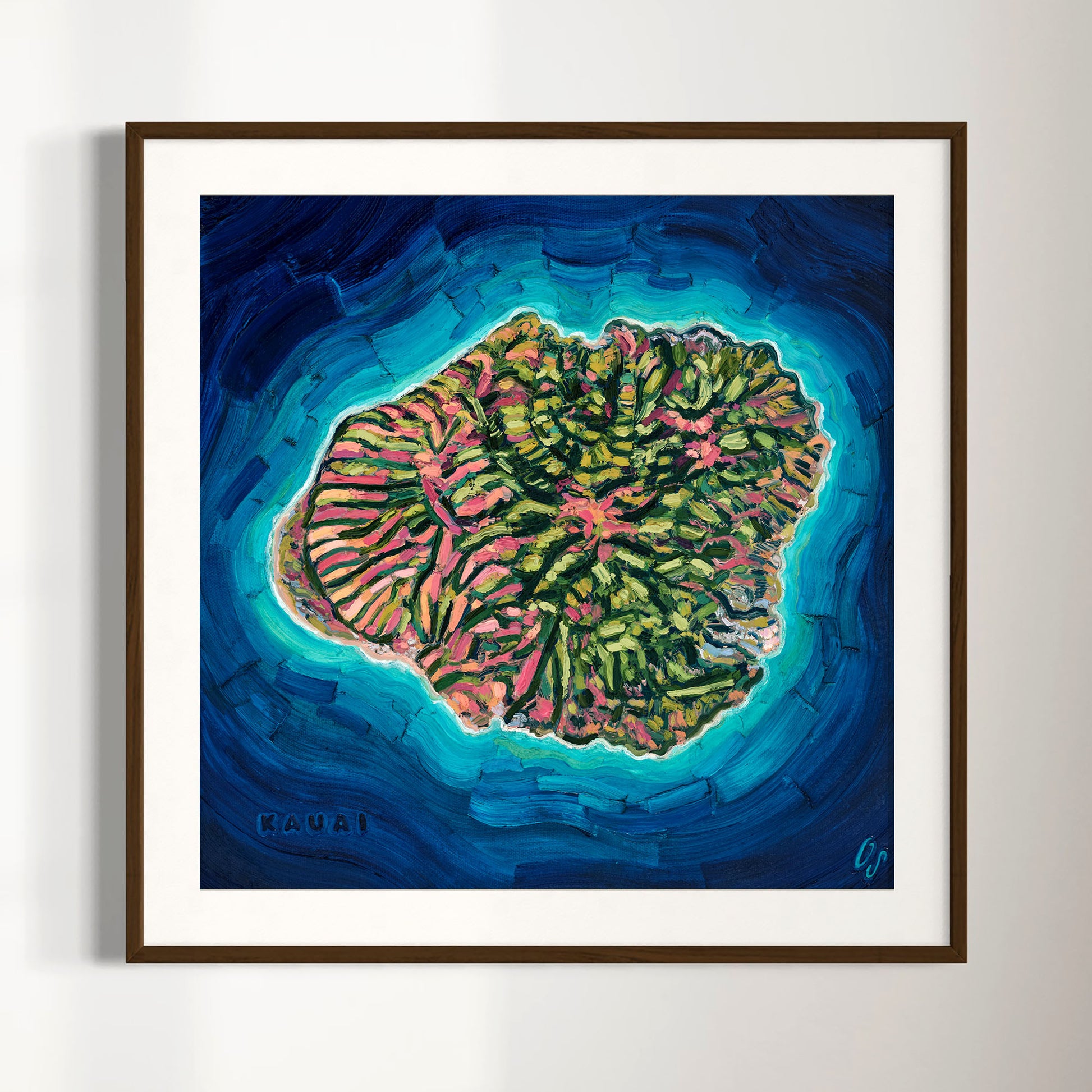Framed square wall art featuring a colorful painted coral reef scene labeled 'KAUAI' in the lower left, shown hanging against a light neutral wall.